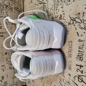 Nike White and Green Athletic Shoes with Minimalist Design